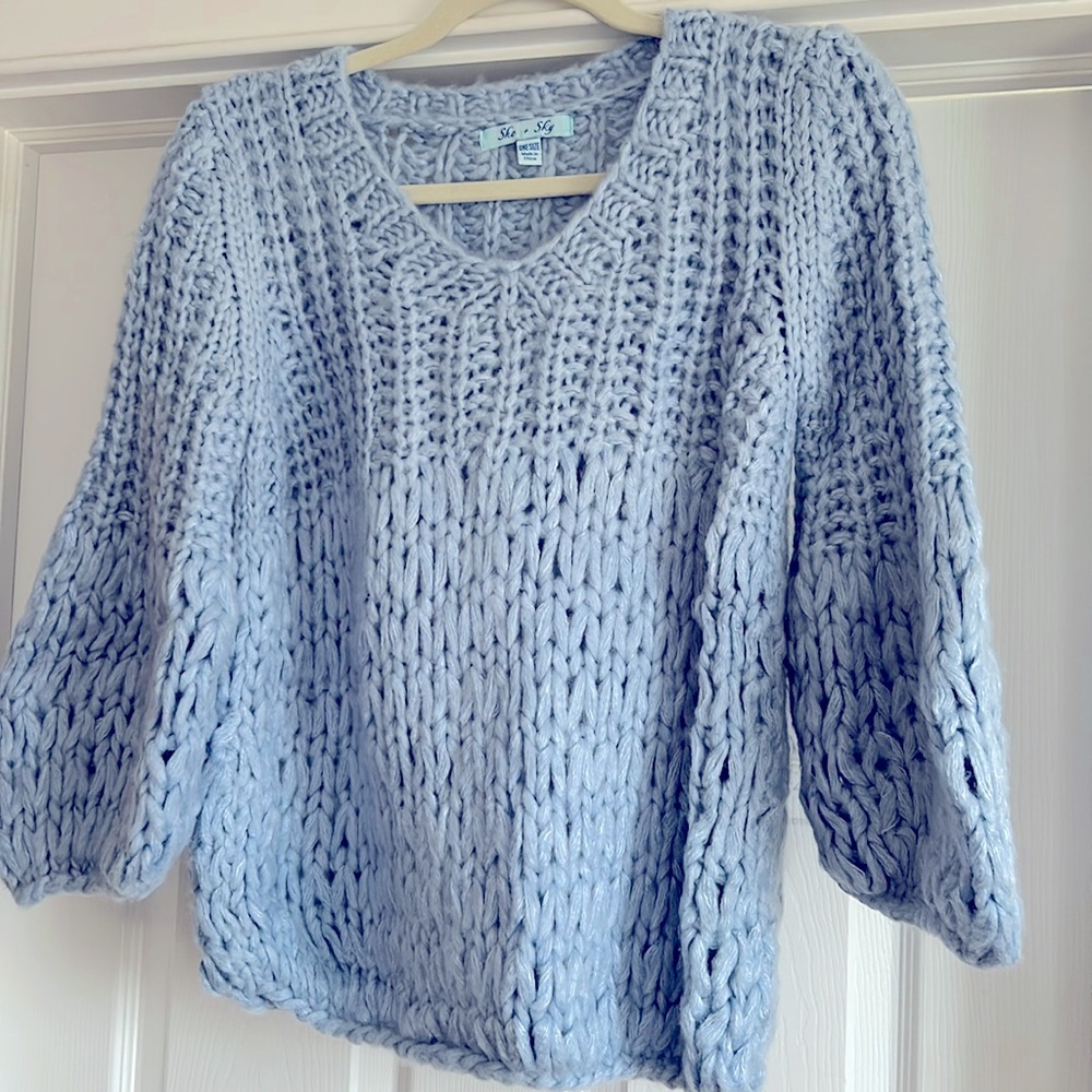She and Sky bright blue sweater in big loopy knit.